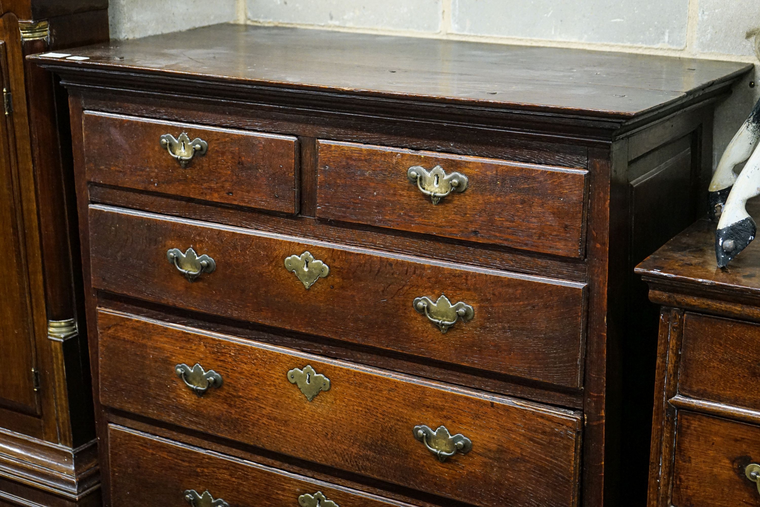 A George III oak chest of two short and four long drawers, on bracket feet, width 102cm, depth 56cm, height 136cm